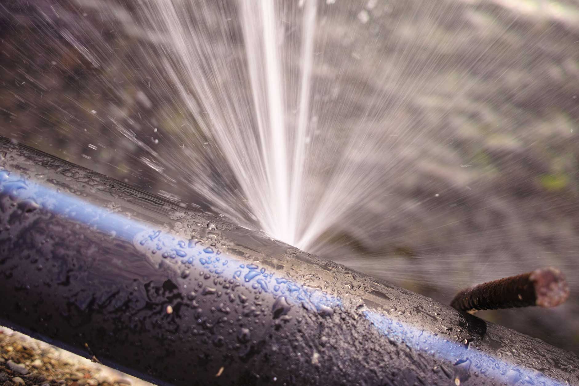 Close-up of water spraying from a burst pipe