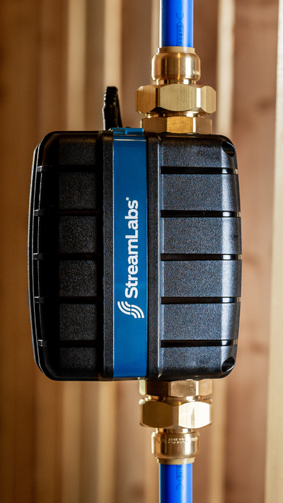 StreamLabs Water device expertly fitted by a technician, showcasing professional installation and advanced leak detection.